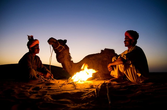 indian-men-resting-by-bonfire-with-their-camel (1) (1) (1) (1)